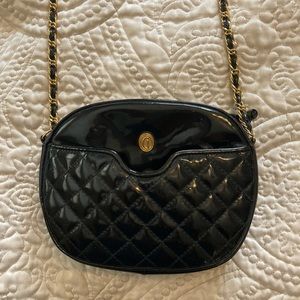 Woman’s Black Leather Purse With Gold Accents